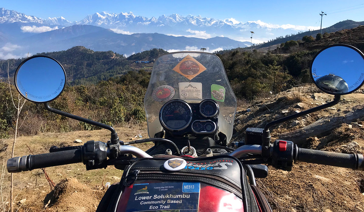 Mountain range with Everest seen from the saddle of the bike.